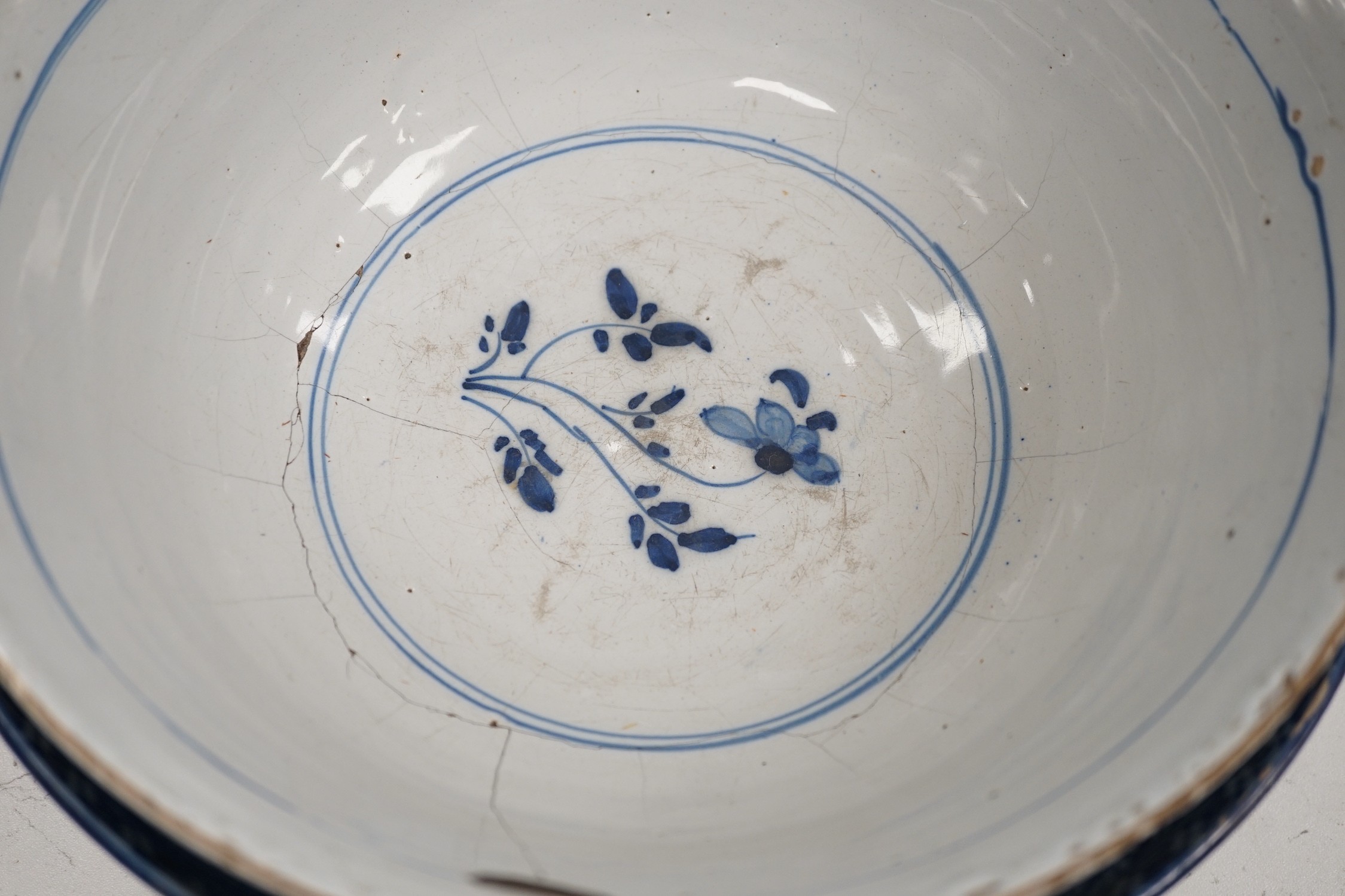 A pair of Delft blue and white candlesticks together with an 18th century Delft bowl, a Moroccan pottery jar with cover, and two pearlware bowls